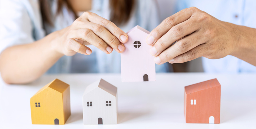 Young couple planning and looking for comparison information on their decision to buy a new home together