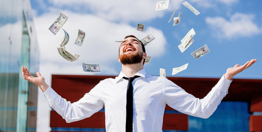 young businessman with falling cash money